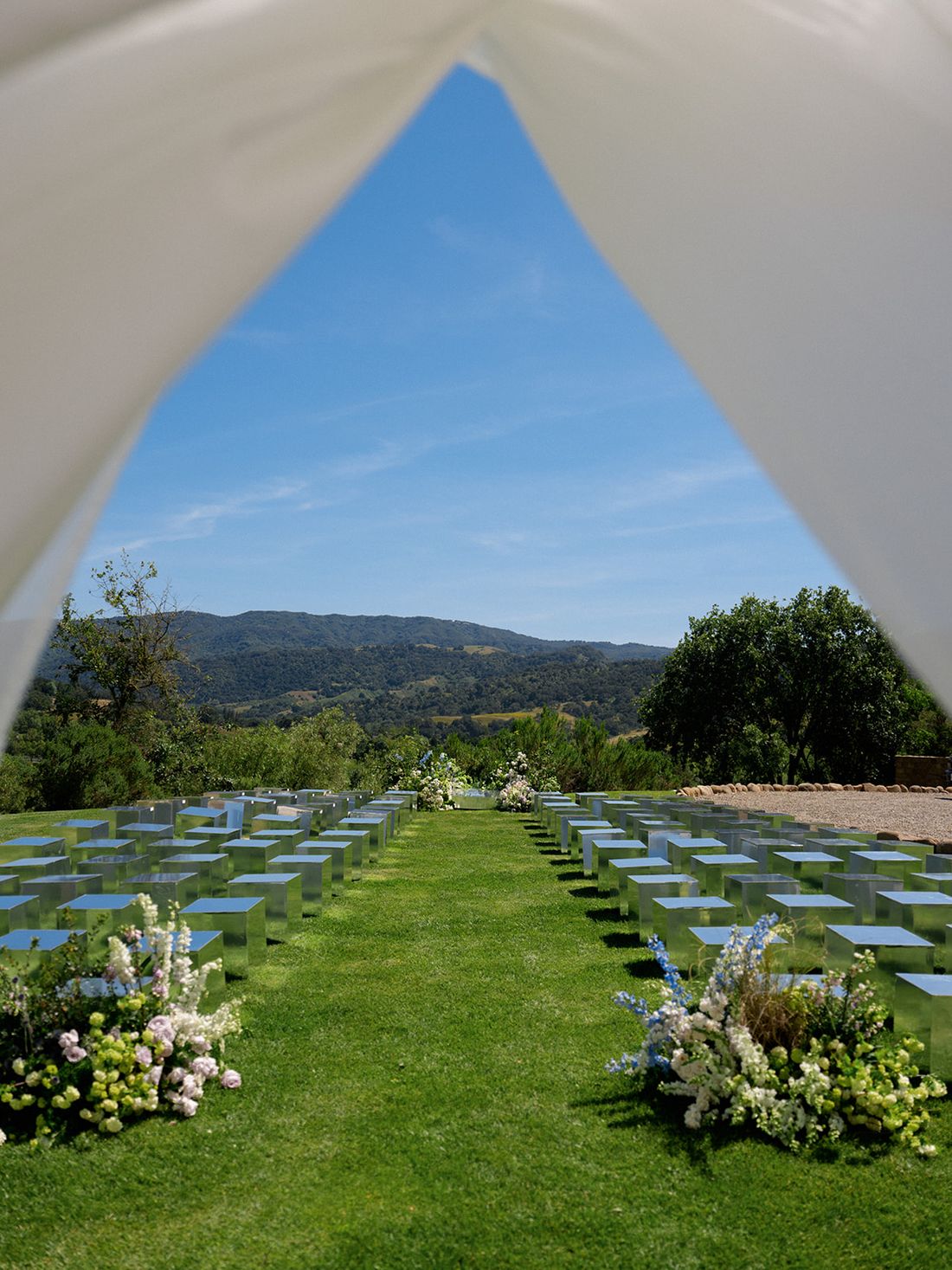 Custom mirrored ceremony arch on a lawn