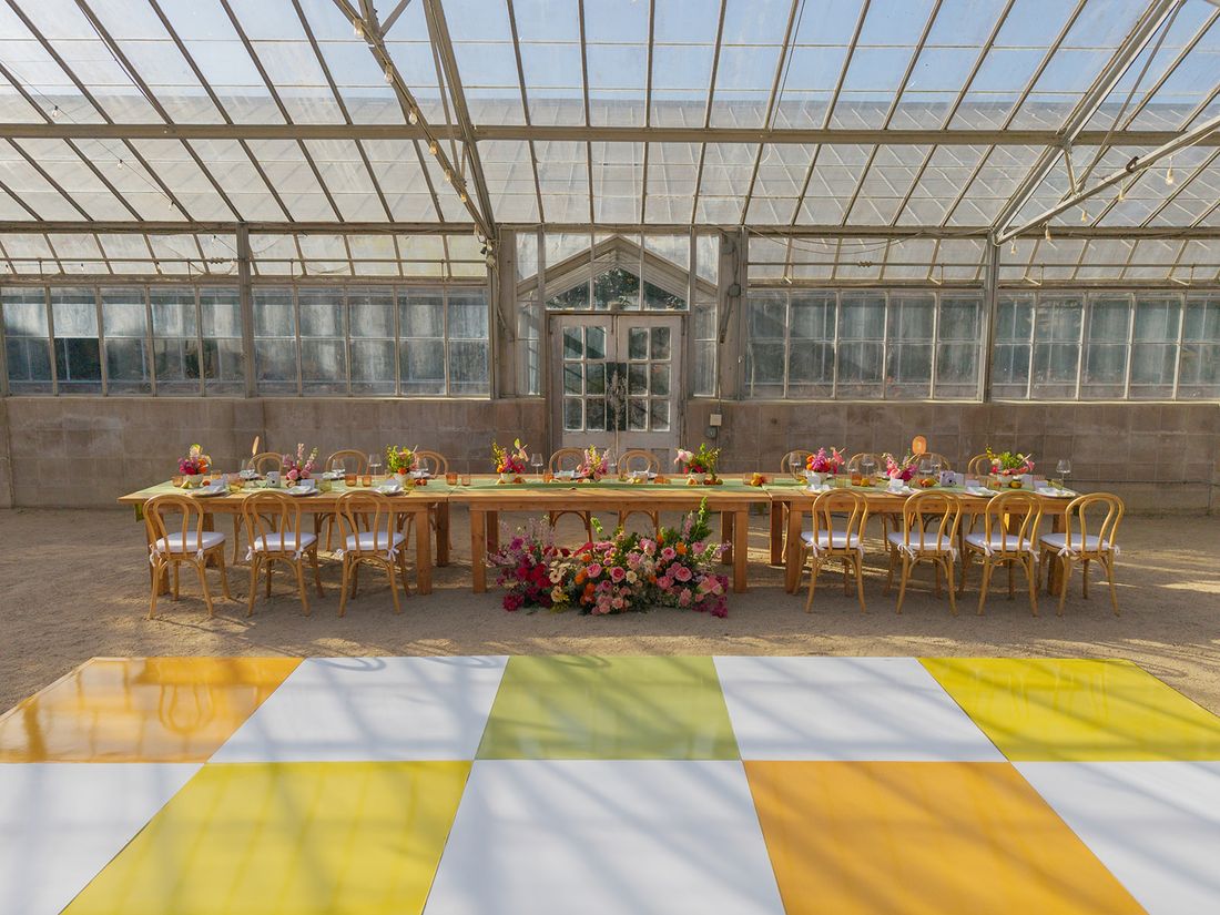 Custom dancefloor and tablescape build in a glass conservatory