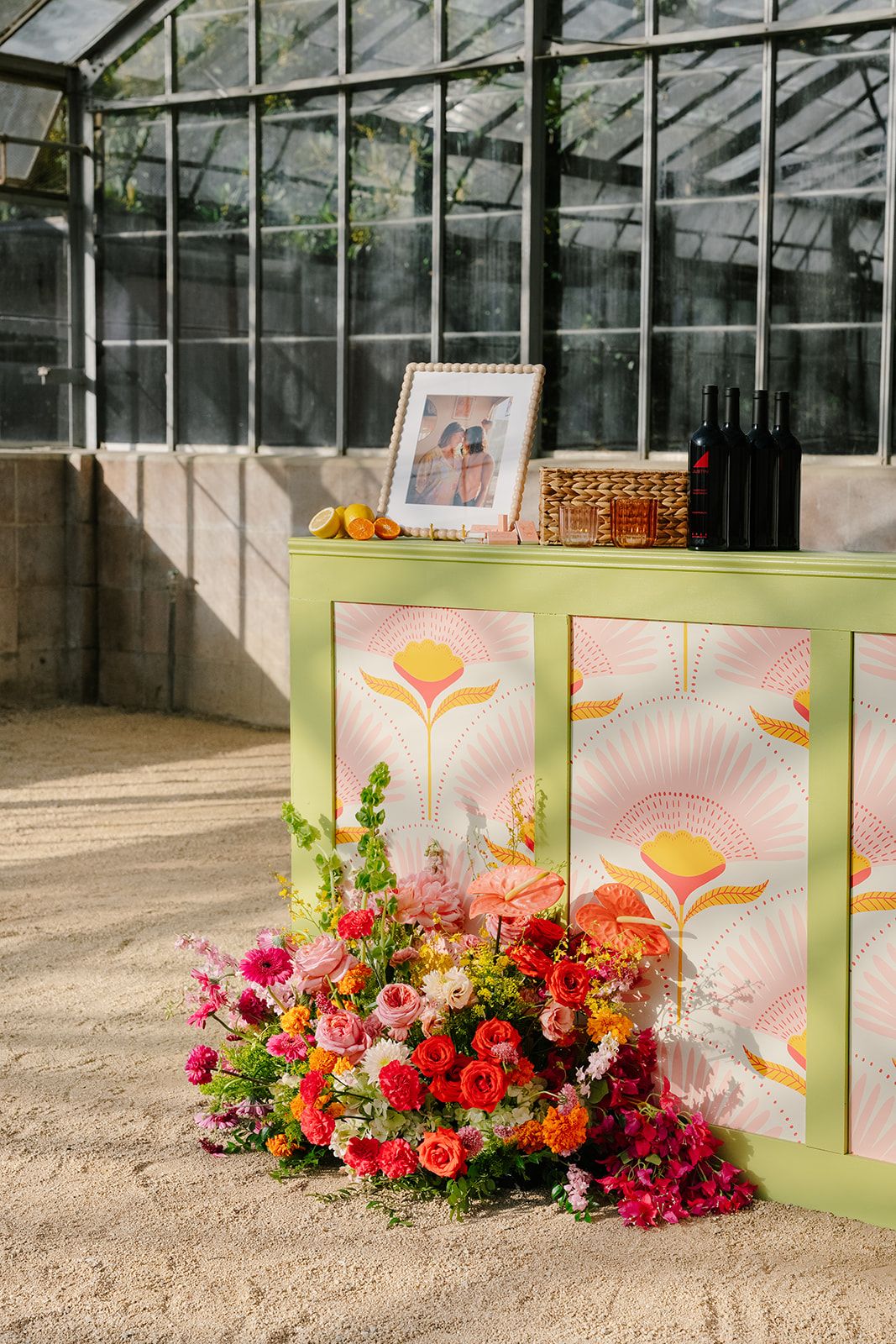 Custom signage and display with floral on a custom floor